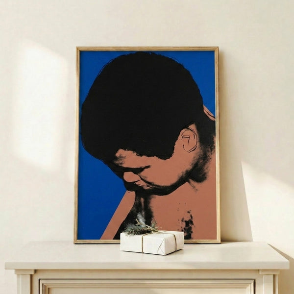 Muhammad Ali portrait in Andy Warhol pop art style with vivid jewel tones and graphic boldness displayed on wall.