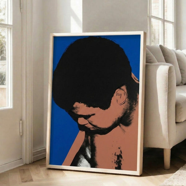 Bold pop art depiction of Muhammad Ali featuring iconic silkscreen printing technique with vibrant layered colors.