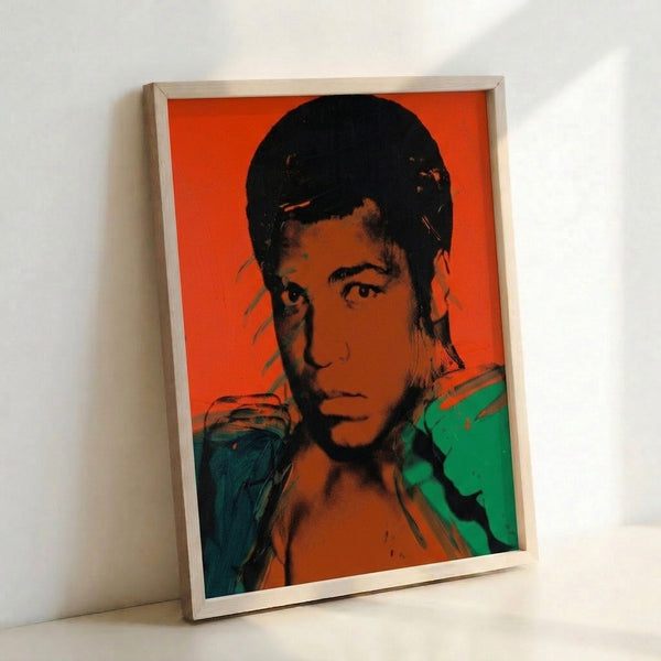 Muhammad Ali portrait rendered in bold pop art aesthetic with saturated colors and graphic line work, displayed as a framed wall print.