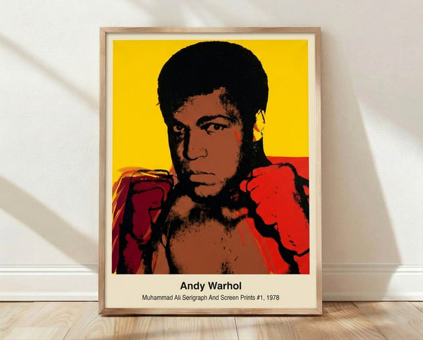 Bold pop art serigraph portrait of Muhammad Ali in vibrant red, yellow, and blue tones with black outlines, celebrating the legendary boxer in Warhol's iconic style.
