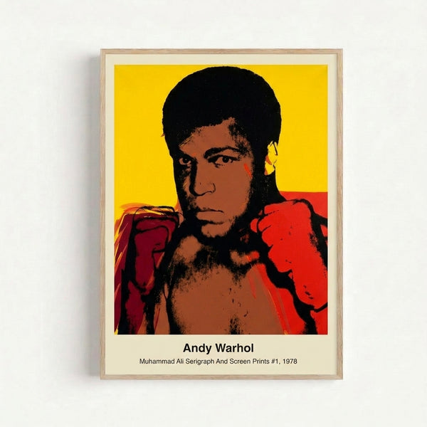 Framed pop art print featuring Muhammad Ali's portrait rendered in bright primary colors and high-contrast black, capturing the boxer's powerful presence in modern artistic style.