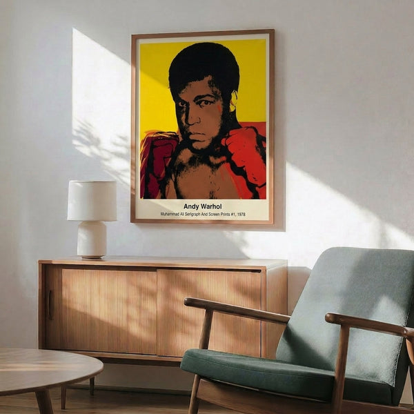 Framed modern pop art poster of Muhammad Ali rendered in saturated primary colors with bold black contours, embodying the celebratory spirit of Warhol's iconic style.