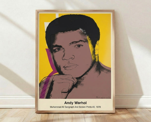 Bold pop art portrait of Muhammad Ali in Warhol style, featuring vibrant yellow, red, and black colors on white background, framed as a modern wall poster.