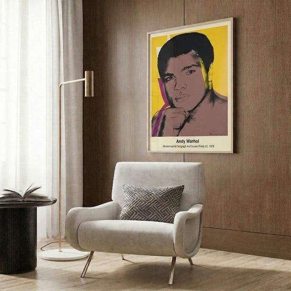 Contemporary pop art poster of Muhammad Ali featuring the boxer's iconic face in Warhol's signature style with bright yellow and red color palette.
