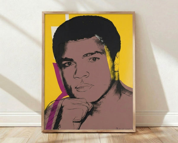 Bold pop art serigraph portrait of Muhammad Ali in vibrant colors, featuring the iconic boxer's face with high-contrast layered hues typical of 1970s screen print style.