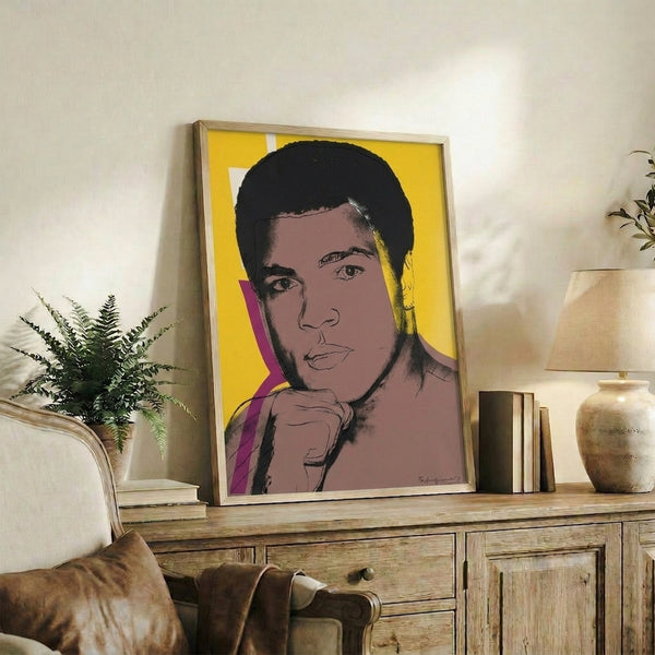 Colorful pop art serigraph showing Muhammad Ali's iconic face in layered, contrasting hues with the flatness and boldness of screen print technique.