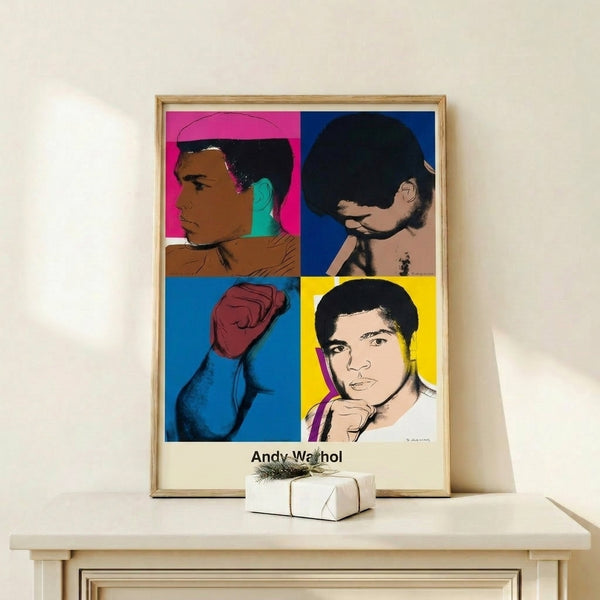 Andy Warhol's pop art interpretation of Muhammad Ali striking an iconic fighting stance, rendered in bold black outlines with vibrant colored accents on the framed wall art.
