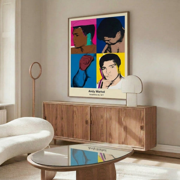 Pop art wall print of Muhammad Ali in a dynamic athletic pose with fists up, created in Warhol's distinctive style using high-contrast blacks and vibrant color fields.
