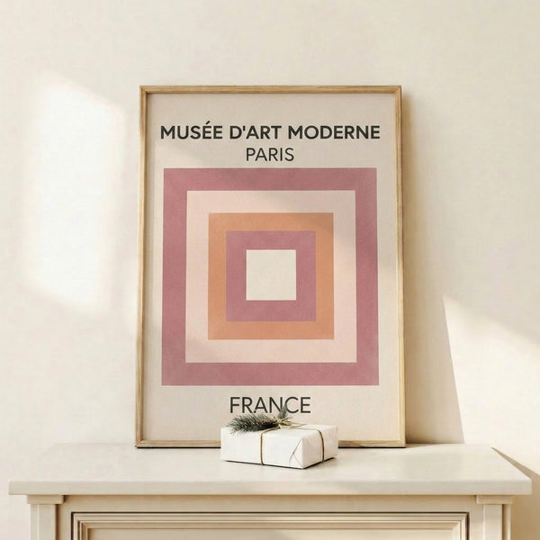 Framed Bauhaus-style poster showcasing nested squares in muted mauve, peach, and cream with clean black outlines.