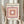 Serene minimalist poster featuring layered geometric squares in peachy mauve and cream, framed as contemporary wall decor.