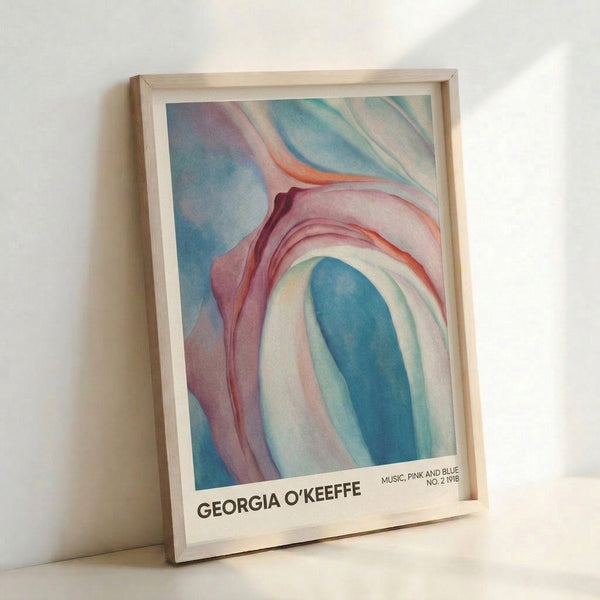 Soft abstract floral artwork with layered pink and blue petals, evoking a meditative, intimate aesthetic on the wall.