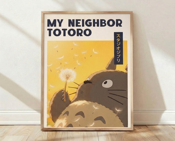 Framed anime poster featuring Totoro holding a dandelion against a golden sunset sky, rendered in soft yellow, brown, and cream tones with a whimsical, peaceful Studio Ghibli aesthetic.