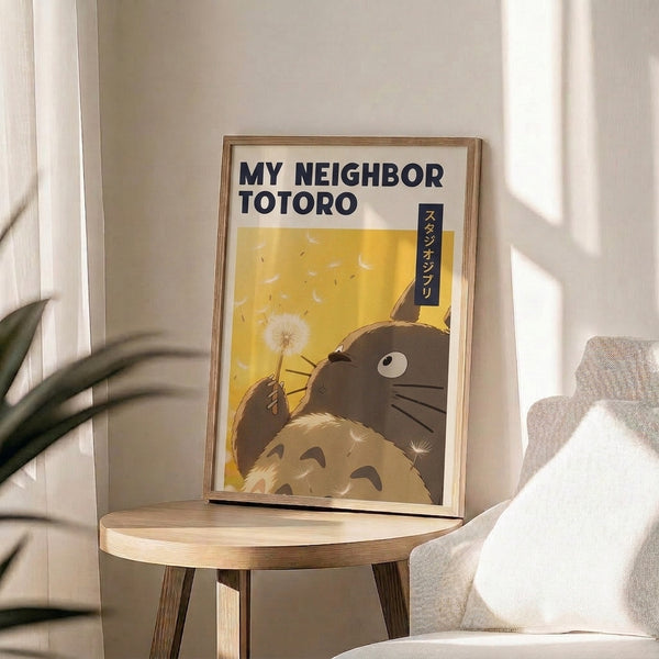 My Neighbor Totoro poster art showing the iconic forest spirit with a delicate dandelion flower, combining soft cream and yellow hues with navy blue in a tender, whimsical composition.