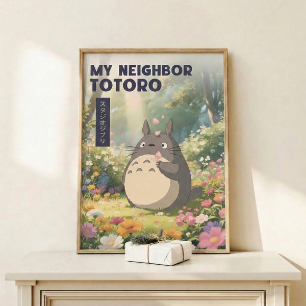 Watercolor illustration of Totoro surrounded by flowering plants and drifting petals, framed on a wall with warm cream and cool sage green hues in a peaceful, dreamy composition.
