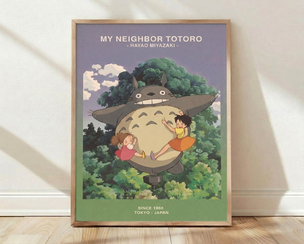 Whimsical Studio Ghibli poster featuring a gentle gray forest spirit embracing two children beneath towering trees, rendered in soft cream, green, and blue tones that evoke magical companionship.