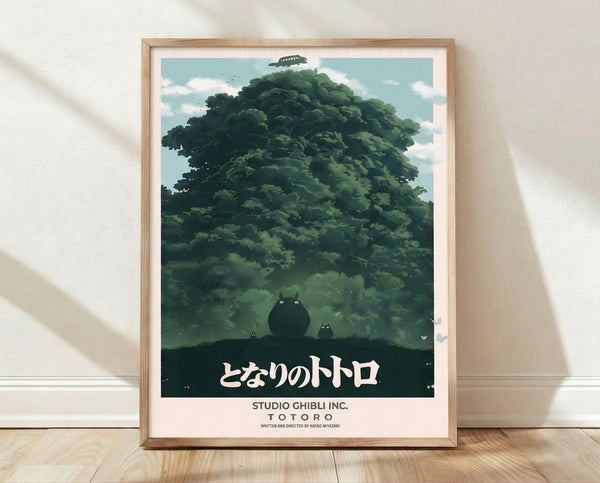 Framed minimalist poster featuring a silhouetted forest creature beneath a towering camphor tree, with a flying ship in the sky, rendered in forest green, cream, and charcoal against a soft blue background.