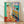 Abstract figure study of a reclining nude woman in warm ochre and earth tones, rendered in simplified Matisse style on a framed poster.