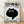 Minimalist black cat illustration with a quirky, anxious expression, rendered in black and white on a framed poster in a modern interior setting.