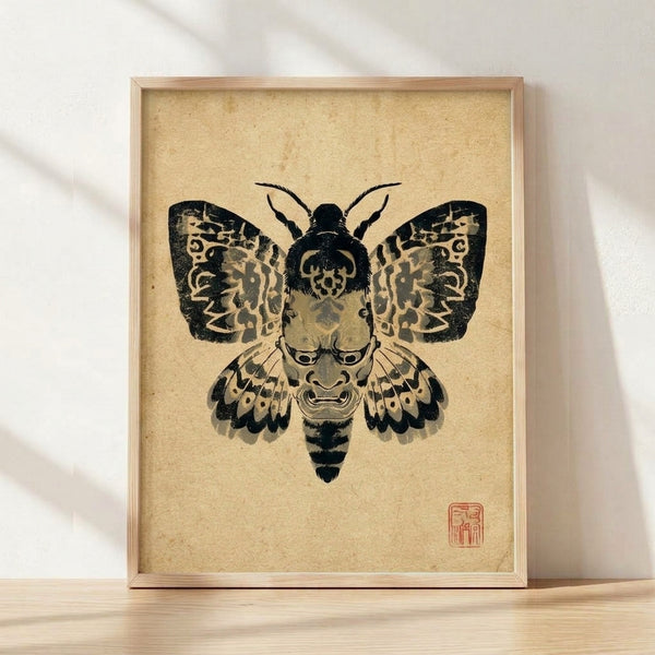Framed Japanese woodblock poster featuring a stylized moth with a theatrical noh mask face in cream, black, and gray tones, evoking mysterious and darkly elegant aesthetics.