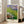 Classic impressionist water garden poster showing lily pads and blooms rendered in luminous lavender, blue, and green tones creating a meditative mood.