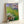 Impressionist Nympheas poster showcasing floating water lilies with dreamy, blended colors in soft greens and blues hung as wall decor.