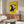 Quirky pop art wall art featuring a distinctive bull character in bold golden yellow and black with white floral elements, creating a whimsical modern poster.