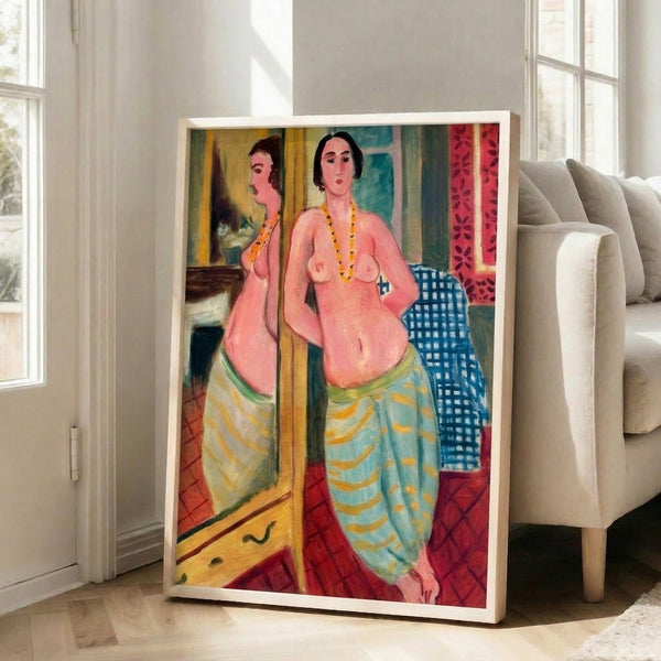 Framed artwork showing an elegant reclining figure with her mirror reflection, composed in warm ochre and coral against deep blue and cream, evoking introspective beauty.