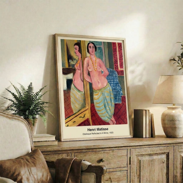 Modern art print of a contemplative woman and her mirrored reflection in an interior setting, featuring sensual curves in coral, ochre, cream, and deep blue tones.