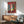 Matisse's odalisque composition framed as a print, blending human presence with patterned screens and furnishings in subdued, naturalistic tones.