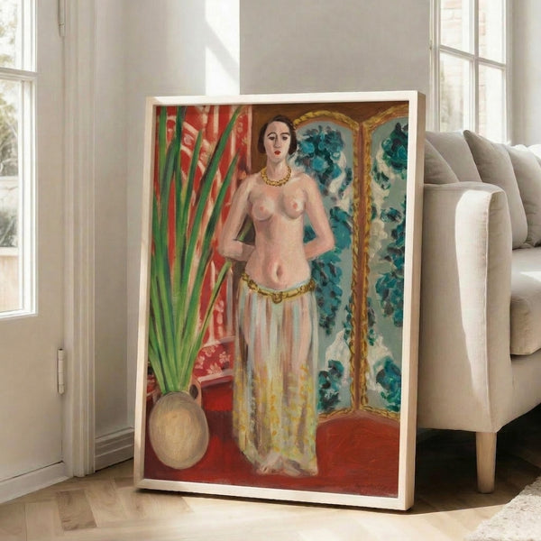 Framed decorative print featuring a reclining odalisque with classical poise, executed in bold simplified forms and a palette of warm golds, reds, and soft neutrals.