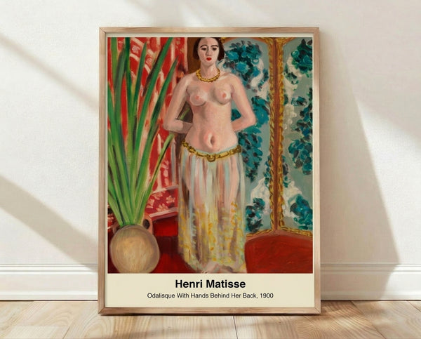 Framed modern art print of a contemplative woman with hands behind her back, rendered in ochre, brown, and cream tones with muted green accents in an Art Nouveau style.