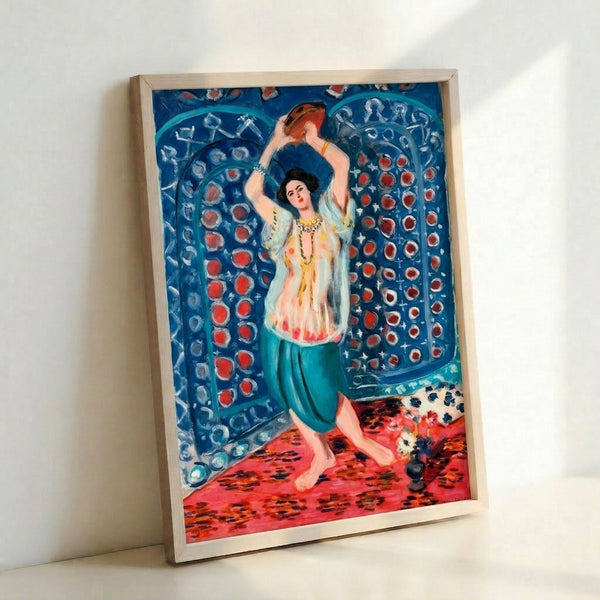 Vintage-inspired framed artwork showing a seated odalisque with tambourine in Matisse's signature modernist palette of rich reds, blues, and earth tones.