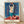 Matisse-inspired framed poster featuring a sensual odalisque figure holding a tambourine, rendered in warm ochres and soft pinks against deep blue fabric, Art Nouveau style.