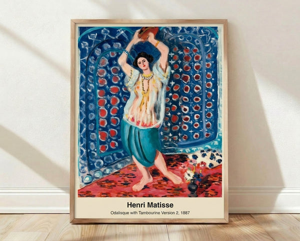 Matisse-inspired framed poster featuring a sensual odalisque figure holding a tambourine, rendered in warm ochres and soft pinks against deep blue fabric, Art Nouveau style.