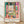Vibrant Matisse-inspired framed poster depicting an open window overlooking a seascape with sailboat, potted plants, and flowers in emerald green, coral pink, ocean blue, and golden yellow.