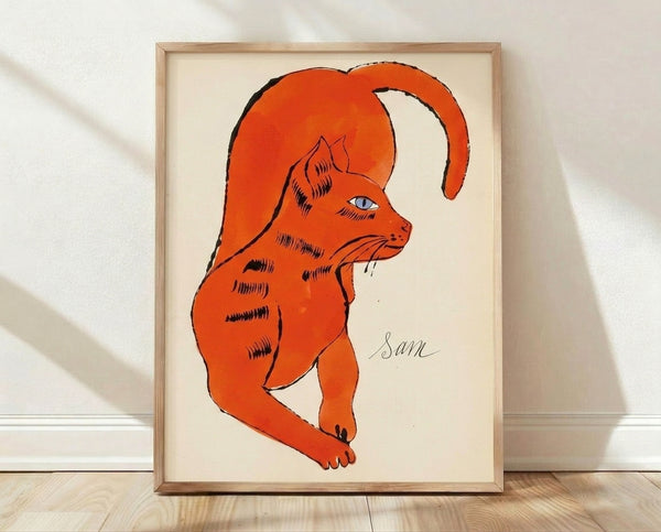 Pop art style orange cat portrait with bold, vibrant colors and high-contrast styling inspired by Warhol's iconic technique, displayed as a framed poster on a wall.