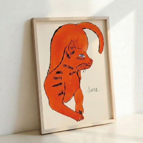 Vivid pop art cat print featuring an orange feline subject with characteristic Warhol-inspired color blocking and bold outlines in a framed display.