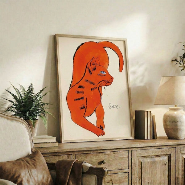 Colorful pop art interpretation of an orange cat with bold hues and stylized features, shown as a framed art poster on display.