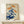 Refined woodblock-style lily flower print with rust brown and orange blooms against deep navy, featuring naturalistic green foliage in elegant Japanese aesthetic.