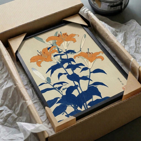 Minimalist Japanese floral print framed on wall showing gracefully rendered lilies in muted earth tones and blue, capturing zen garden elegance with refined botanical detail.