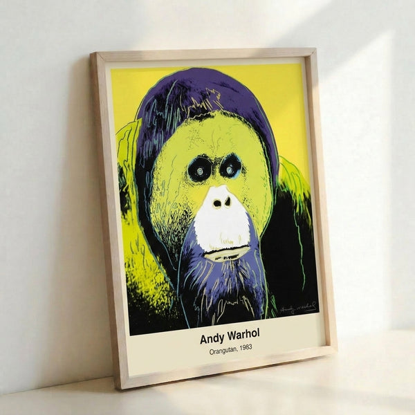 Colorful pop art orangutan poster with a conservation message, displaying the animal in vivid pink and cyan tones characteristic of Warhol's approach.