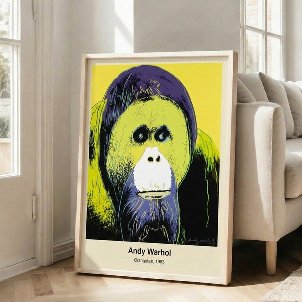 Contemporary pop art wall print showcasing an orangutan's face in bold chartreuse, bright pink, and magenta hues against a dark background.