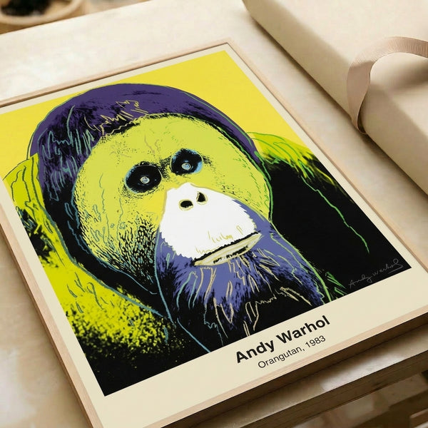 Pop art orangutan print in electric pink, cyan, and lime featuring the distinctive Warhol silkscreen aesthetic on a black ground.