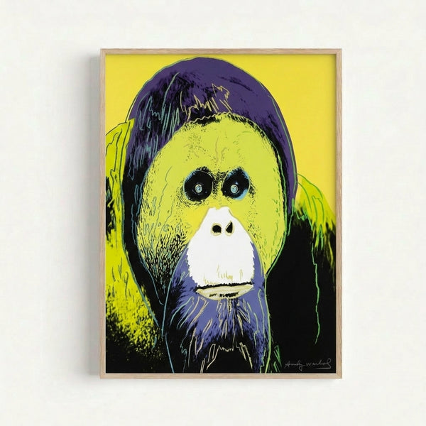 Bold, colorful orangutan artwork featuring bright acidic greens and magentas in a modern pop art aesthetic, framed and hanging.