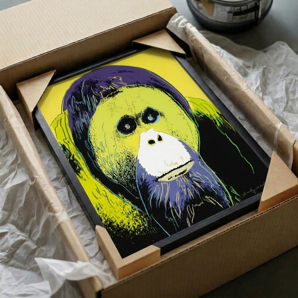 Modern pop art framed poster of an orangutan rendered in saturated colors including deep red, lime, and turquoise with high-contrast styling.