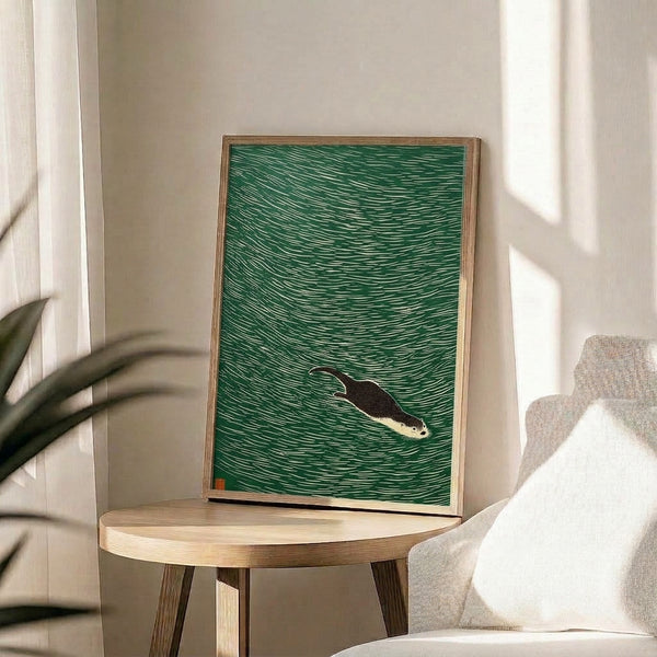 Serene wall art depicting an otter in motion through stylized water, executed in minimalist black line art with forest green and rust accents on cream paper.