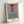 Soft-focus Impressionist poster of the iconic Palazzo Contarini with a boat gliding through the tranquil canal, bathed in golden light and cool blue hues.