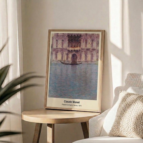 Impressionist framed print showing the elegant palazzo and canal gondola in soft, atmospheric colors including blue, yellow, and warm beige with contemplative, diffused light.