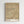 Framed modernist print featuring layered abstract forms in warm earth tones with introspective, pattern-based design characteristic of early 20th-century avant-garde art.