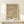 Abstract artwork in muted ochre and tan palette displaying meditative composition with subtle pattern work and minimalist geometric sensibility.
